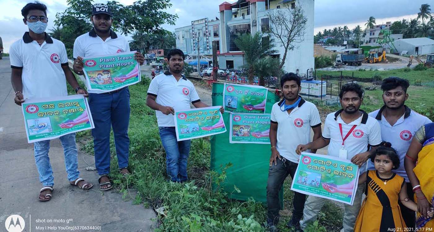 Group of people posing outdoors